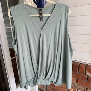 Sage green sleeveless top.